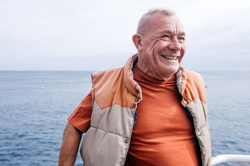 Happy gentleman by the water