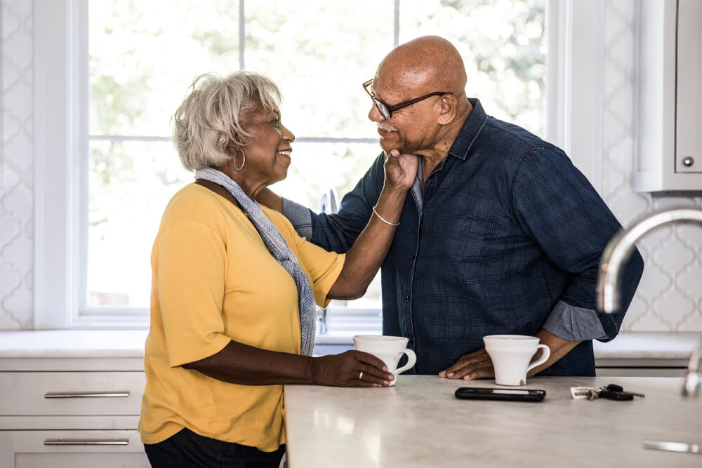 Happy couple in their kitchen